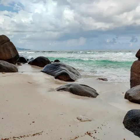 Huge granitic boulders on a beach on the seych