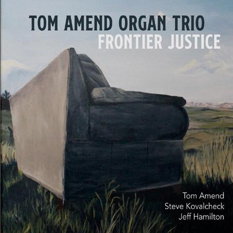 An image of the cover of the record album 'Frontier Justice' by Tom Amend Organ Trio