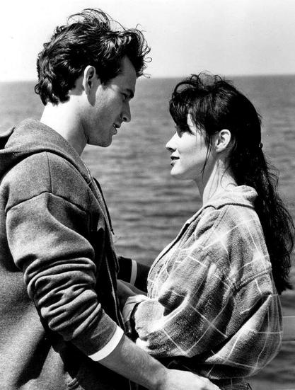 Black and white photo of Dylan McKay and Brenda Walsh, portrayed by Luke Perry and Shannon Doherty, respectively, in Beverly Hills 90210.