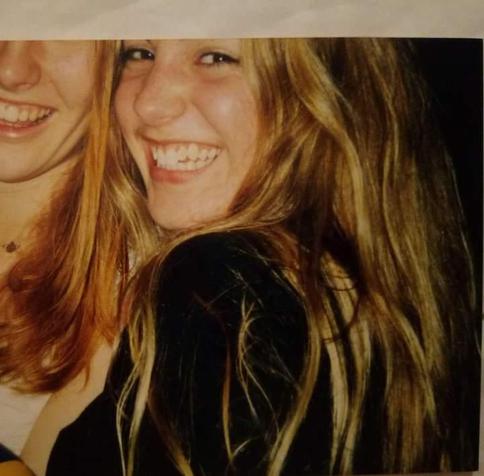 Colour; square: Two teenage girls, myself on the right, with a big goofy smile and wild, long, blonde hair.