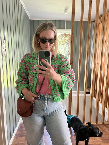 Girl in green and pink jacket