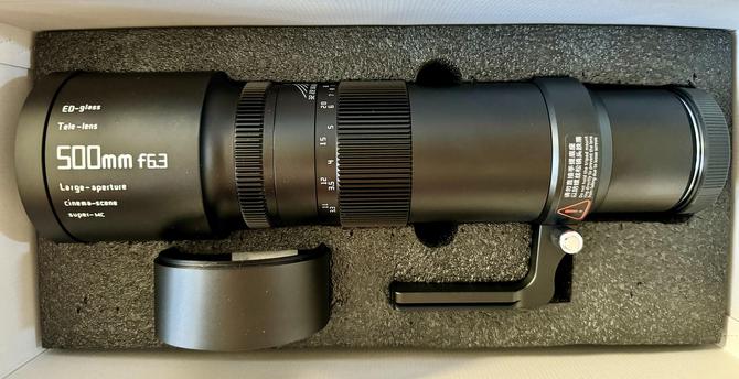 The TTArtisan 500mm f/6.3 lens in its box.  Comes with caps for both ends, a tripod mounting foot (with Arca Swiss rails) and a (small) hood. 