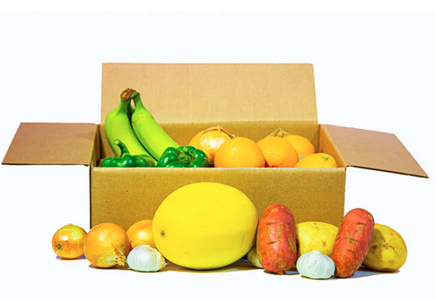 A cardboard box of fruit and veg is shown - not a specific order, but representative of the deliveries from a distributor of local produce.