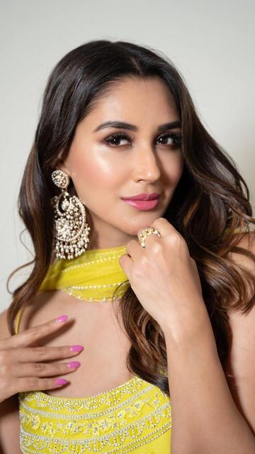 Nikita Dutta dazzles in Ashutosh Joshi's black and gold saree, showcasing a perfect blend of tradition and contemporary fashion. The rich fabric and detailed craftsmanship make this saree a standout piece. Nikita's look is the perfect inspiration for those seeking timeless elegance.
