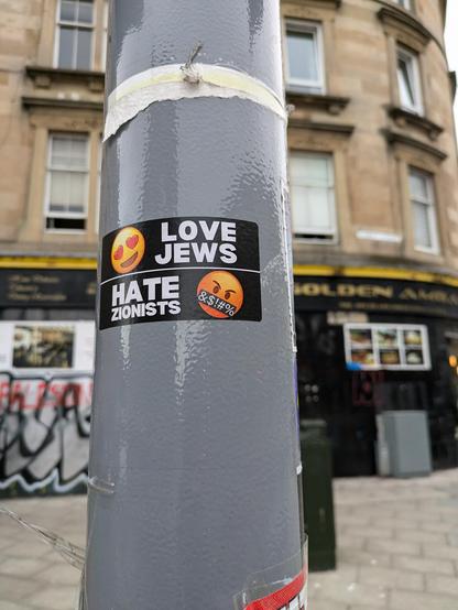 Sticker on lamppost reads love Jews hate zionists