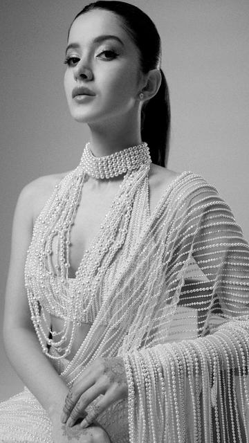 Dive into a world of luxury with Shanaya Kapoor's latest look in a Manish Malhotra saree crafted with 1 lakh pearls. This exquisite creation highlights the designer's mastery in combining traditional craftsmanship with modern aesthetics. Shanaya Kapoor's enchanting presence adds to the saree's allure, making it a perfect choice for those seeking elegance and style. Experience the glamour and beauty of this pearl-adorned saree and let it inspire your fashion journey with its timeless appeal.