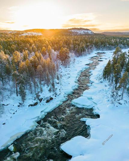 Snow-covered river in Lapland, Finland