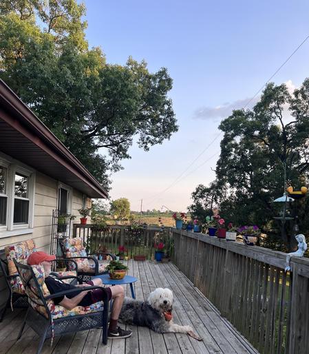 My view of the deck from the hot tub. Murray is looking right at me. Birds have been swarming my vintage feeder. A gorgeous evening. 