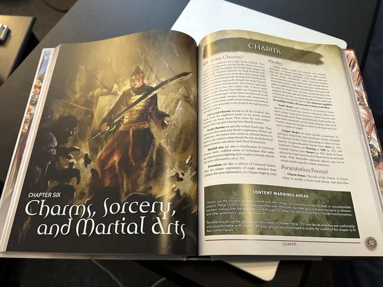 Kickstarter printing of Exalted Essence. Open to Charms, Sorcery, and Martial Arts chapter.