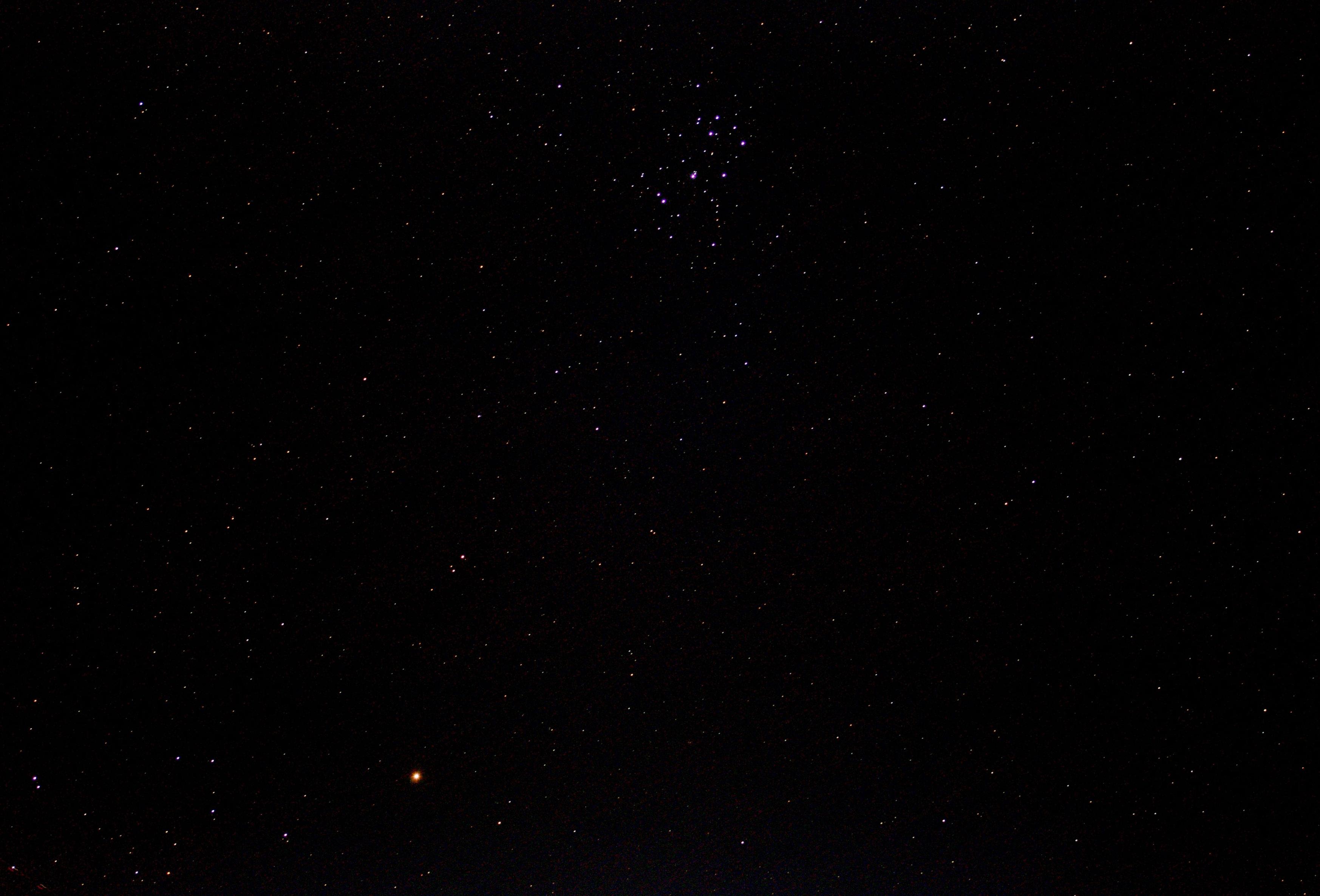 Planet Mars above left of bottom edge. Star c.luster the Pleiades below middle of top edge. 