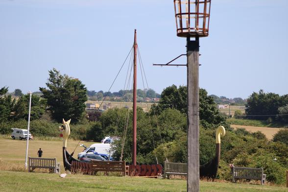 The replica Viking ship at Pegwell Bay behind the fire beacon.