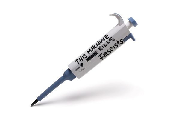A lab pipette with THIS MACHINE KILLS FASCISTS written on it