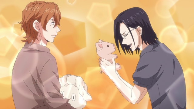 A teenage boy (Gichi) laughing while holding a plush pig which came out of a plush gyoza which another teenage boy (Kikuchihara) is holding.