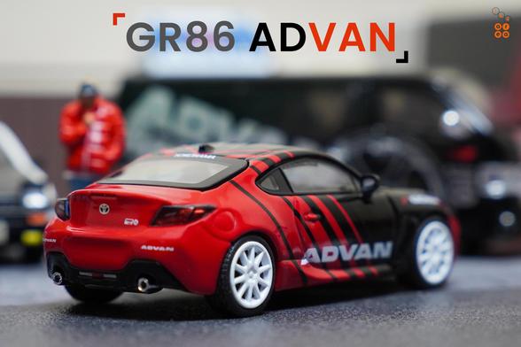 A right side of Toyota GR86 Advan livery by Pop Race in 1:64 scale with 1:64 figure on AREA 164