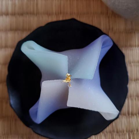 Nona's blue colour 'manten', a sweet that was inspired by the Star Festival. Rice dough is folded like origami to create a star shape, with a splash of edible gold leaf sparkling at the centre.