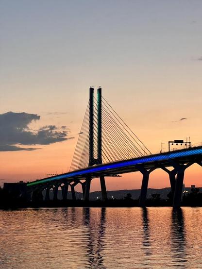 Vertical photo at 77mm of the Champlain Bridge with an end sunset behind