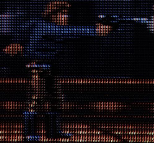 Han Solo from the SNES game Super Star Wars: The Empire Strikes Back on Sony Trinitron CRT TV.

He's standing, shooting a blaster pistol.