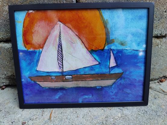 Sailboat on the ocean at sunset