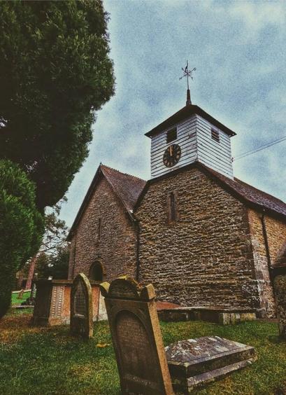 An image of Bourton Church, where Ann Morgan is buried. You can see the tower of the church and the tombstones