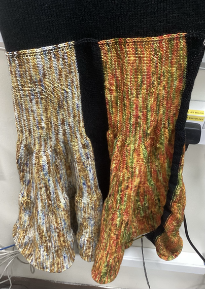 A closer picture of the two coloured sections. The one on the left is white, blue, yellow and gold. The section on the right is red, orange, green and yellow. As you move down the fabric, it becomes slightly more voluminous.