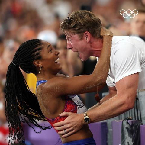 Tara Davis-Woodhall and Hunter Woodhall celebrating her gold in the long jump