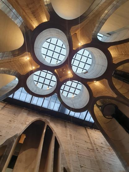 The ceiling with four almost freely floating looking leftovers of upper parts of giant grain tubes. 