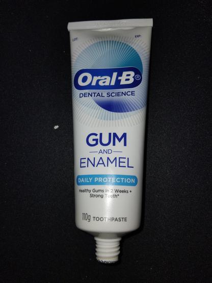 A view of the tube showing the brand name Oral-B.