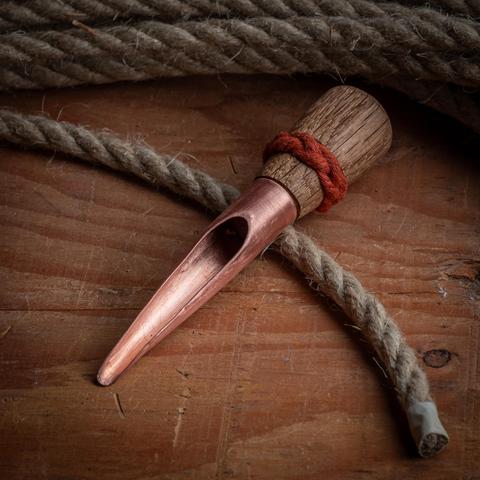 A photograph of a handmade Swedish splicing fid and some of the hemp line it was made to splice.
