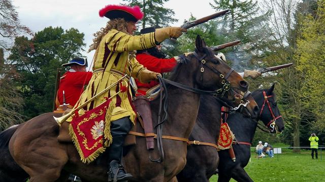 Noble on horseback holding a Pistol. (Renactor)