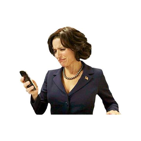 Veep’s Selena Meyer looking at a phone with a displeased expression.