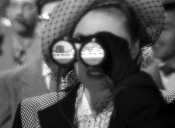 an image of a stylishly dressed woman looking through binoculars
