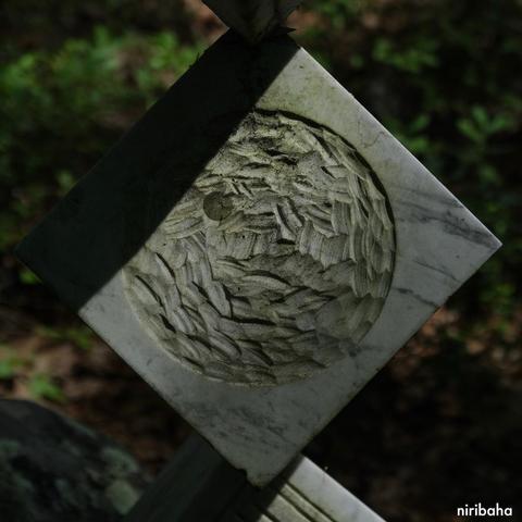 a carved cube of marble with low sunlight highlighting the pattern left by the gentle strokes of the chisel