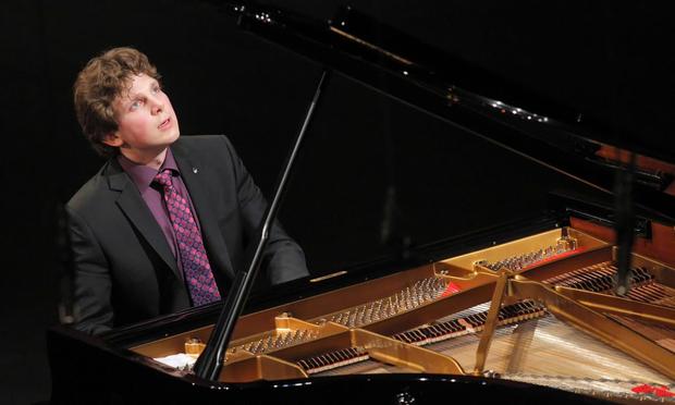 Pianist playing piano in a concert 