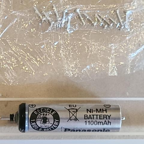 Extracted unique battery and 12 small screws carefully put aside. Luckily the screws are all identical. 