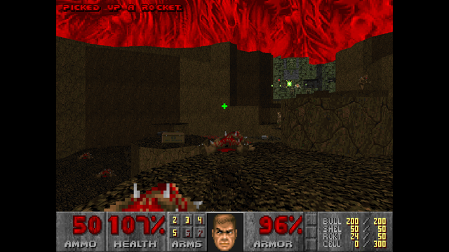 A picture of Doom II: No Rest For The Living. Shown is a picture of gameplay, taken from a first-person perspective, with black bars on the sides.

The picture shows a rudimentary 3D scene, with a limestone-green brick structure on the right in the far horizon, many rocky platforms at several heights, and a gruesome red sky. Part of the brick structure has a mural depicting a horned skull. Dead, bloodied bodies litter the rocky platforms.

In the distance can be seen four figures, two of whom look the same. The two identical figures can barely be seen; they have grey, robotic legs, and large beige bodies. A third figure stands to the right of the camera. They have brown skin, spikes jutting out of their shoulders, and their mouth is wide open. A fourth figure is on the right behind a rock structure; they have light beige skin, their fist is surrounded with some green energy, and they have brown legs reminiscent of goat legs.

Some items can be seen scattered about. A brown box on the left reads 