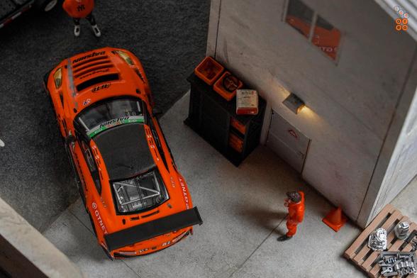 A top eye view of Nissan GT-R Nismo GT3, Super Taikyu Series 2021, Fuji 24 hours 2021, No. 81 Winner by Tarmac Works in 1:64 scale with 1:64 figures on AREA 164