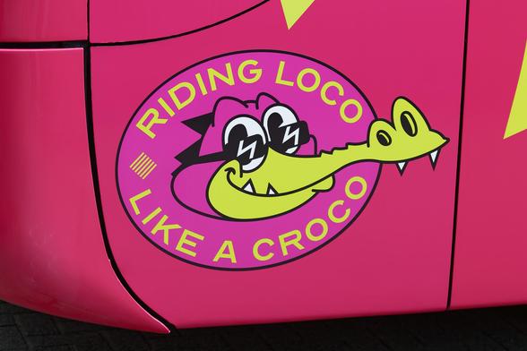 A pink logo of a cartoon crocodile (named Argyle) surrounded by text saying Riding Loco Like A Croco.