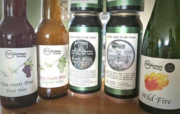 Craft beer from Wilderness Brewing NZ - bottles and cans - next to each other. A tasty line-up.