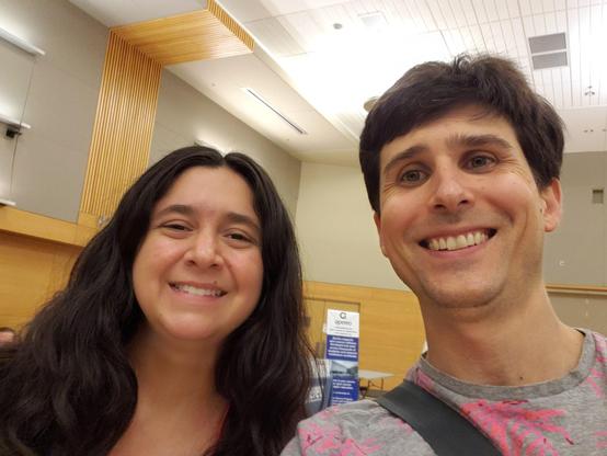 Two people smiling into the camera (selfie).