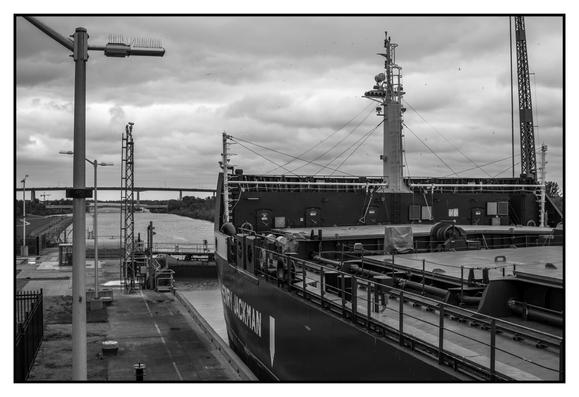 lock is full of water, ship is waiting for the level to drop (it takes about 12 min once they start)