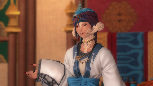 Berin Rinrin in elaborate but light merchant garb, wearing a white and blue coat and a matching turban and golden accessories.