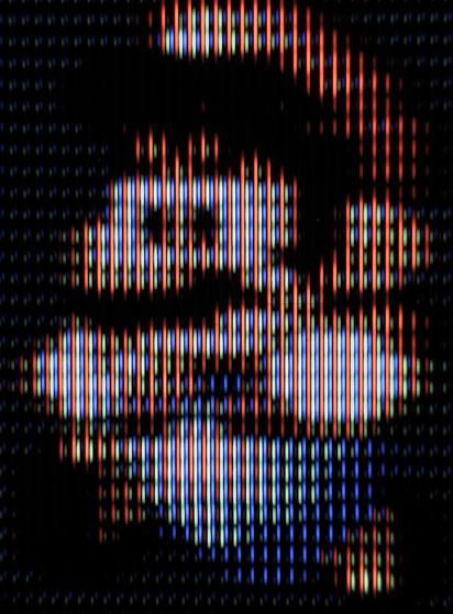 Mario mid-jump in Super Mario World (SNES)