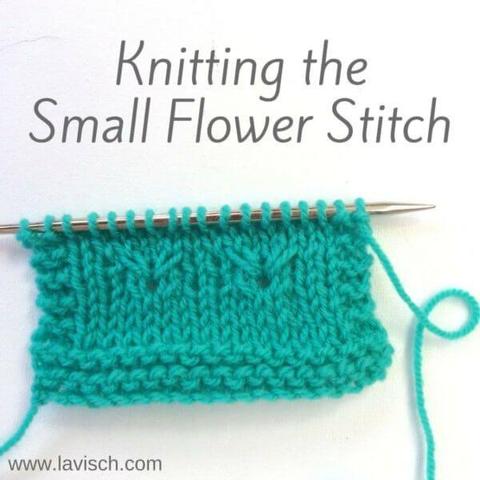 A swatch in turquoise yarn on a knitting needle in which the small flower stitch is demonstrated.