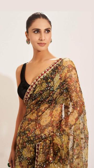 Vaani Kapoor has always been a style icon, and her latest appearance in a Ritu Kumar floral saree reaffirms her status. This masterpiece, priced over two lakhs, features a mesmerizing floral design that effortlessly combines traditional elegance with a modern flair. Ideal for any grand celebration, this saree is a must-have for those who wish to make a lasting impression. Vaani’s look is a perfect example of how to wear luxury with grace and poise.