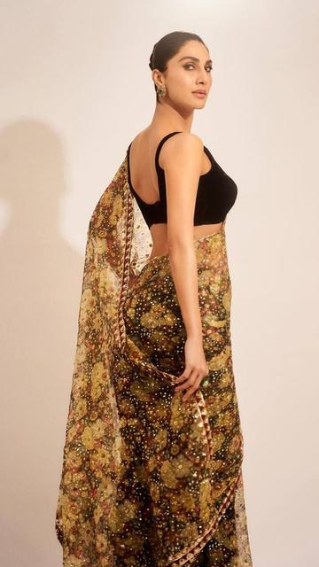 Step into the world of luxury fashion with Vaani Kapoor’s breathtaking floral saree by Ritu Kumar. Priced over two lakhs, this saree is a true masterpiece, featuring exquisite floral designs that are both elegant and timeless. Vaani’s impeccable styling of this saree makes it a must-have for anyone who appreciates high fashion and wants to make a grand entrance at any event. Let Vaani’s look inspire your next fashion-forward purchase.