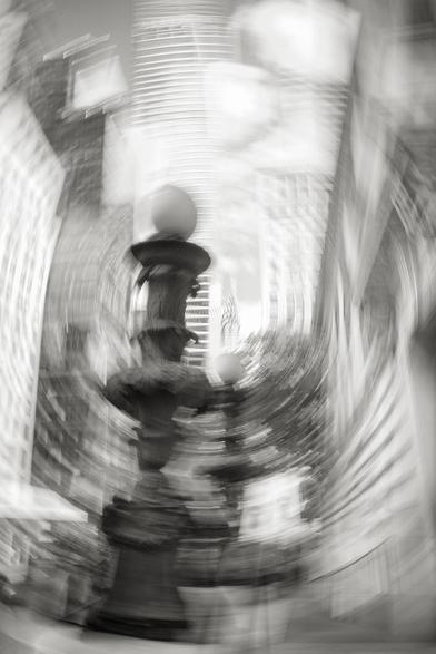 Monochrome intentional camera movement image of Chrysler Building from West 42nd St. in Manhattan.