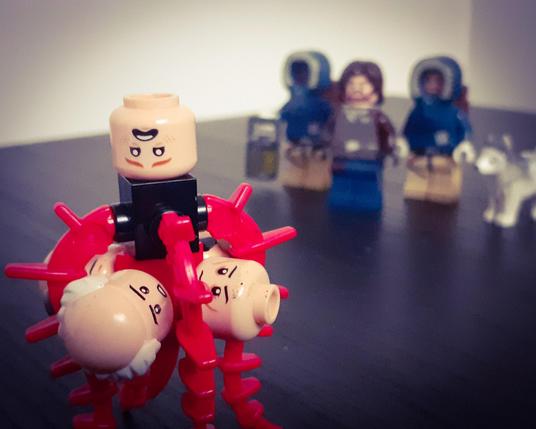 The Thing, with a collection of half-digested human heads protruding from it's body 