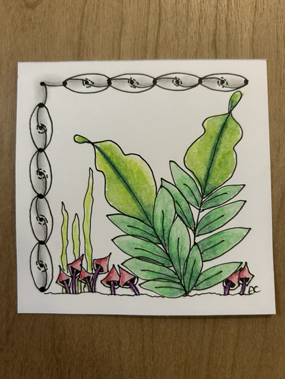 Tangled picture with ovals on left-side and top, plant life drawn on the rest of the square card, red mushroom type shapes, green wavy grass, stalks of leaves, all coloured in water colours 