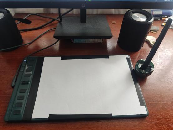 Drawing tablet with. Paper taped on top
