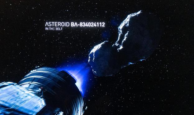 A screenshot from the episode 8 of season 1 of the TV series The Expanse showing the ship the Rocinante decelerating towards an asteroid with stars in the background. The asteroid has a bilobed shape very reminiscent of Comet 67P/C-G that the ESA Rosetta mission rendezvoused with ten years ago this month.